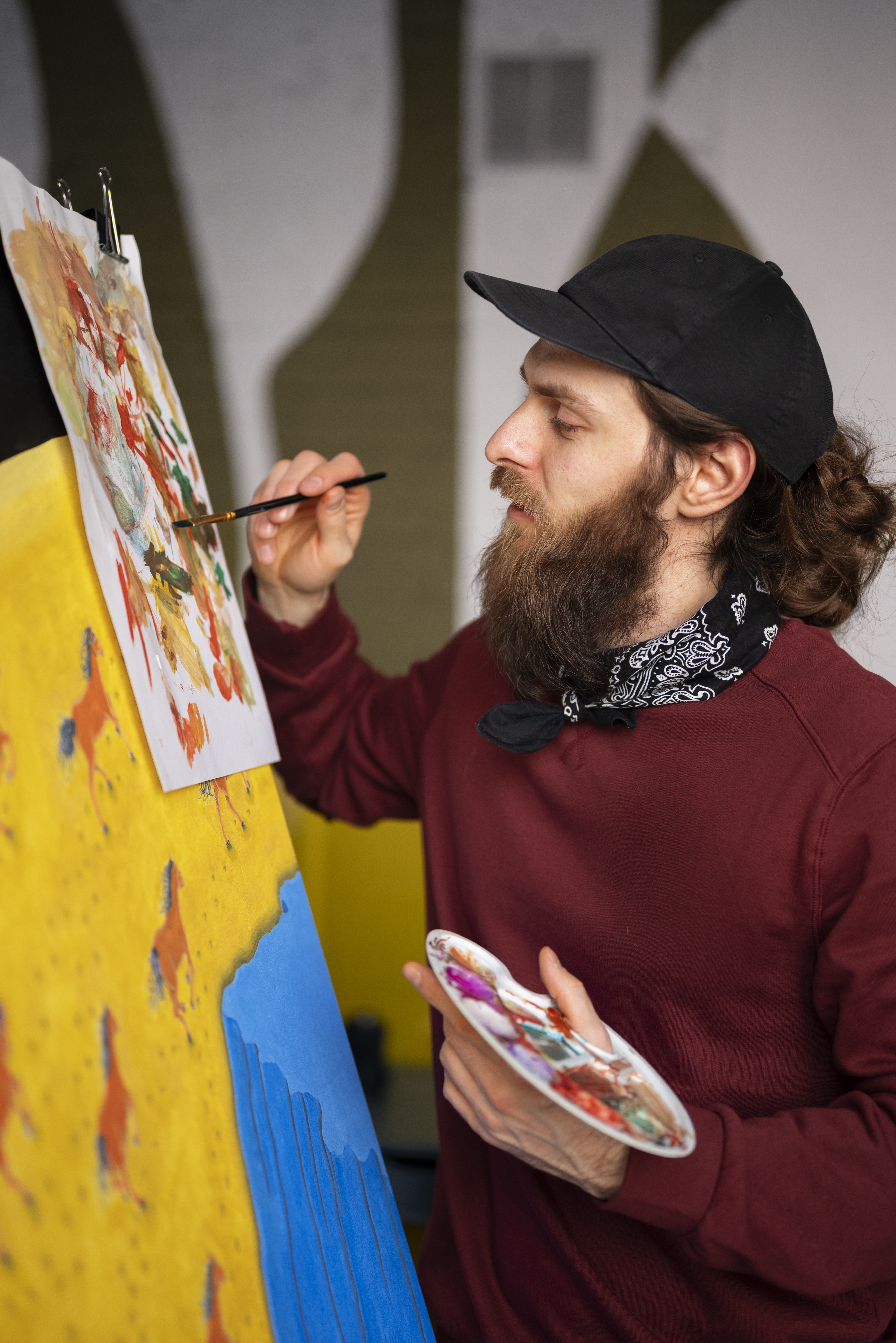 male-painter-studio-using-watercolor-his-art Fine art painting and creativity